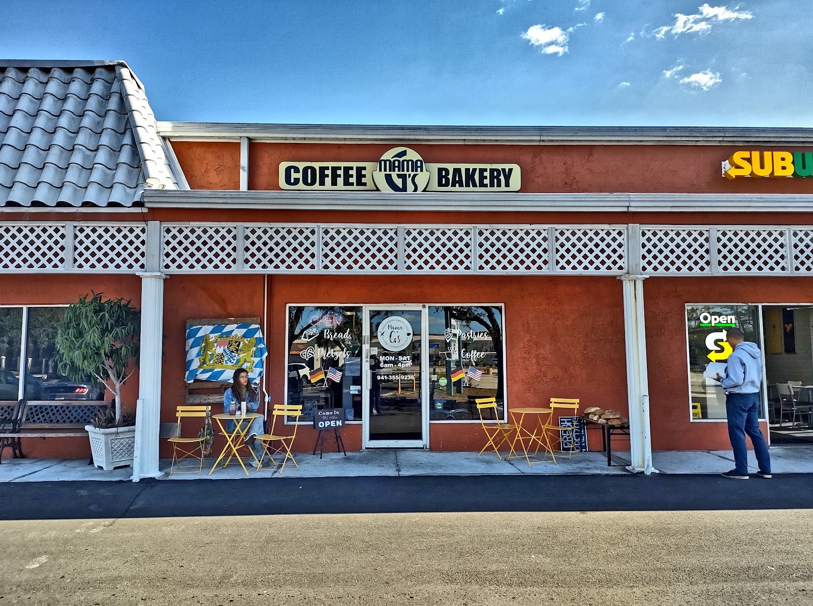 The orange storefront of Mama G's German Bakery & Coffeehouse in Sarasota