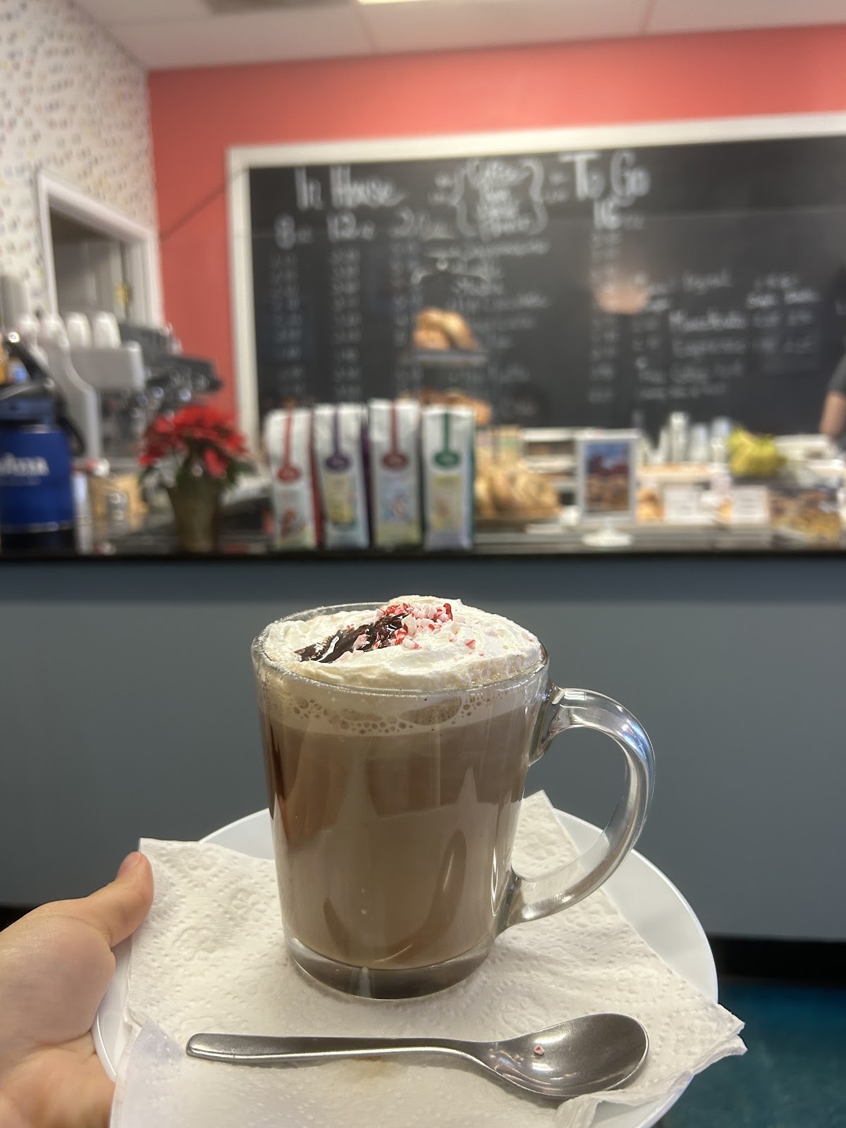 A handcrafted peppermint mocha topped with whipped cream at Mama G's coffeehouse